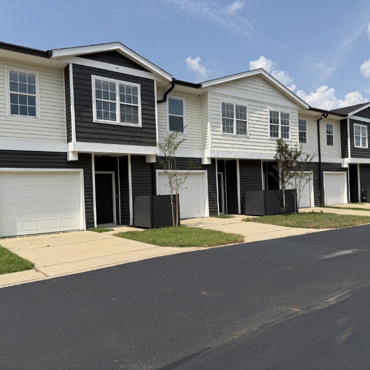 Two-story multifamily townhomes with attached garages at 8221 Pittman Ave, managed by Skyline CPM