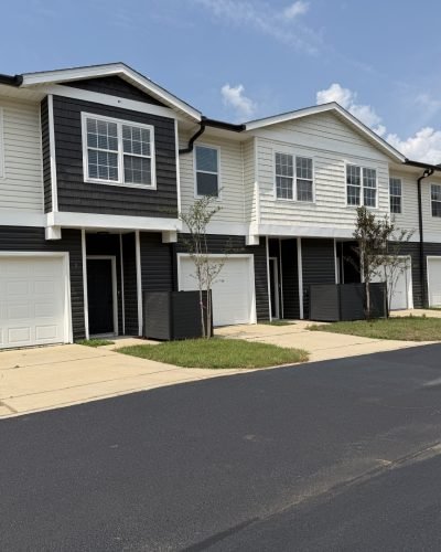 Two-story multifamily townhomes with attached garages on the Gulf Coast